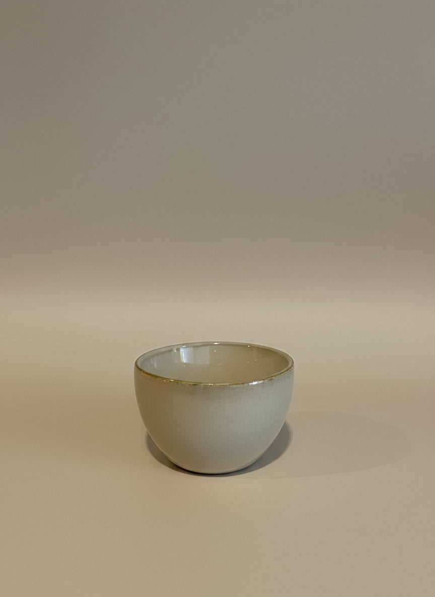 Ceramic bowl mounted on a wooden wall